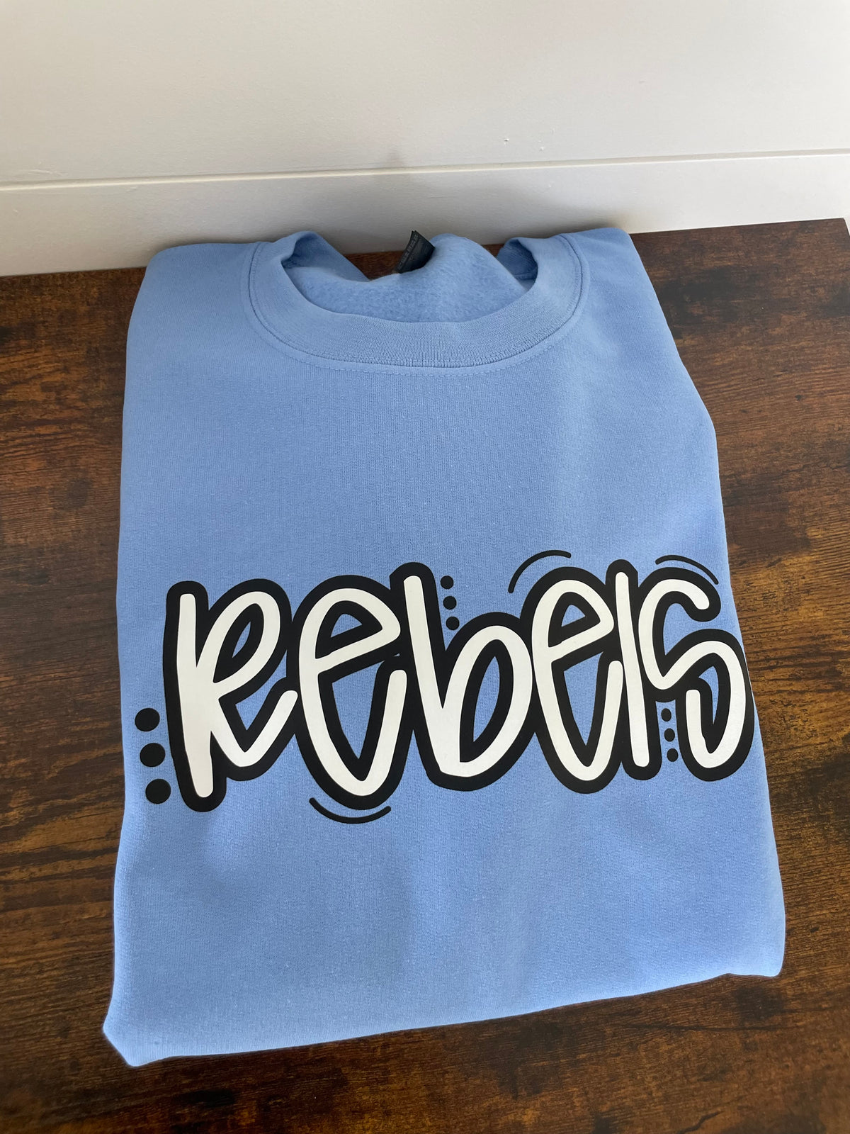 Rebels Carolina blue shirt or crewneck