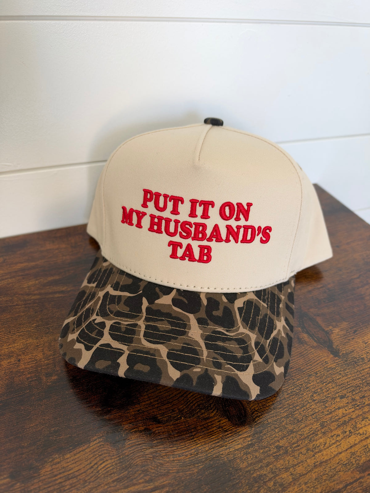 Put it on my husband’s tab hat