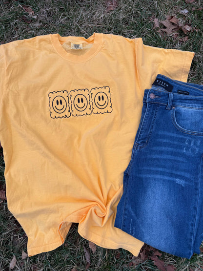 Smiley face embroidered tshirt. 